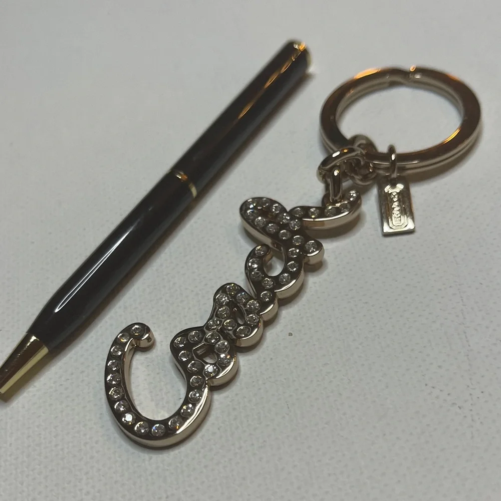 Coach Gold Rhinestone Keychain with a Black Coach Pen